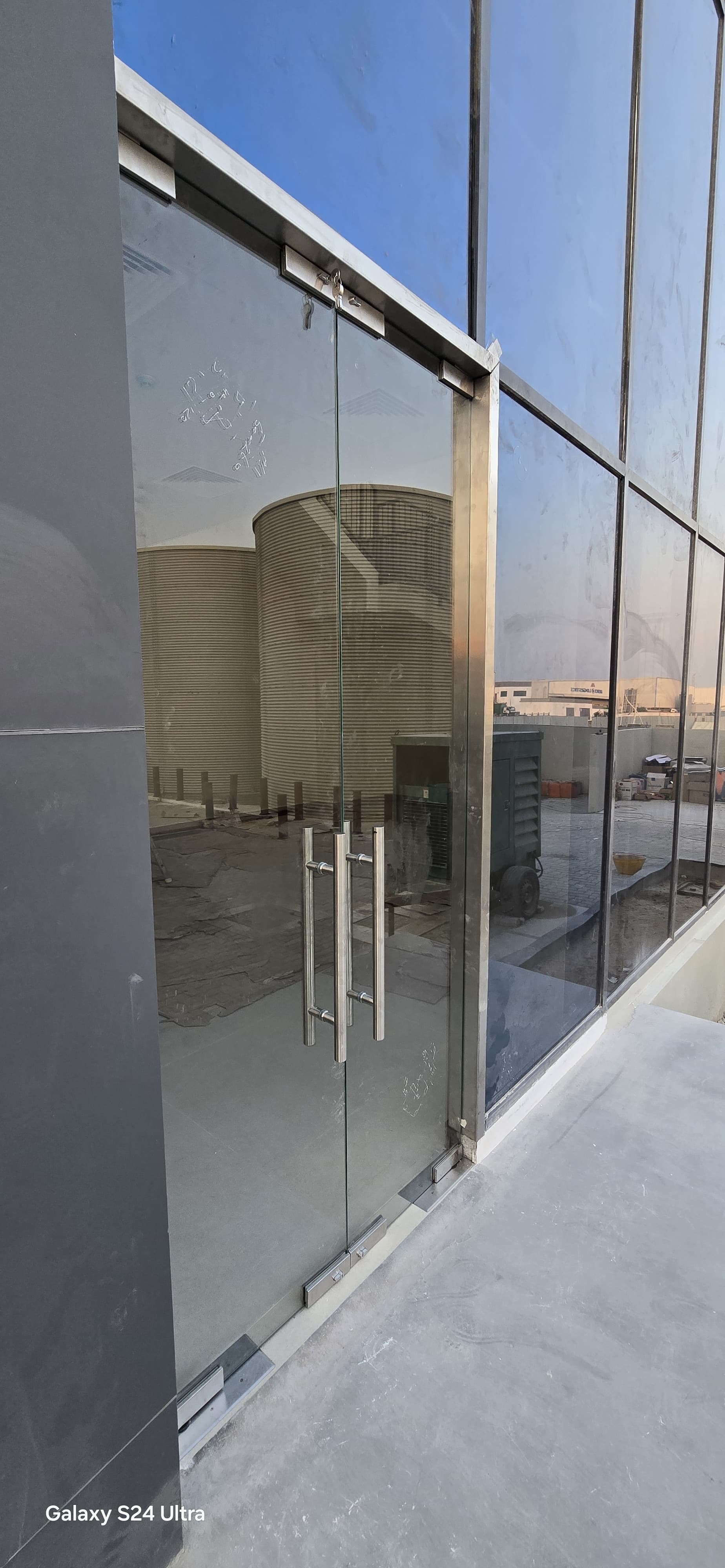       Supply and installation of a clear glass door  and repositioning of the double glass at JAFZA, DUBAI   
